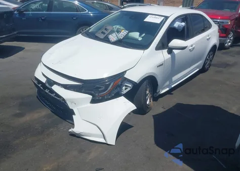 2021 Toyota Corolla Hybrid Le from USA, damaged, VIN JTDEAMDE2MJ031122